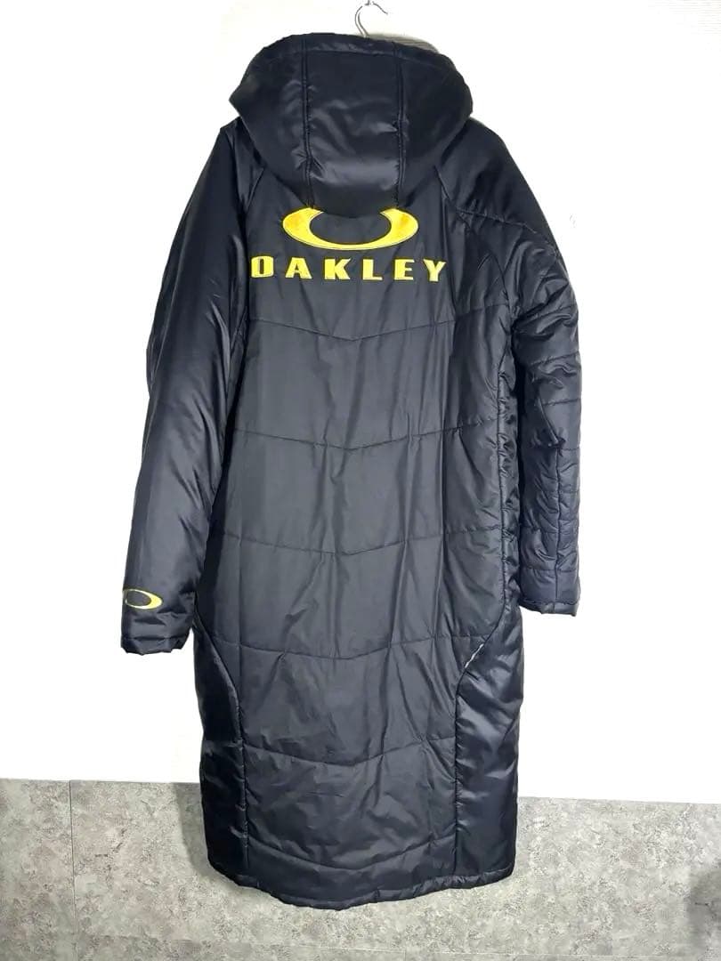 美品OAKLEY オークリー ベンチコート XL ロングコート フード付 ロゴ