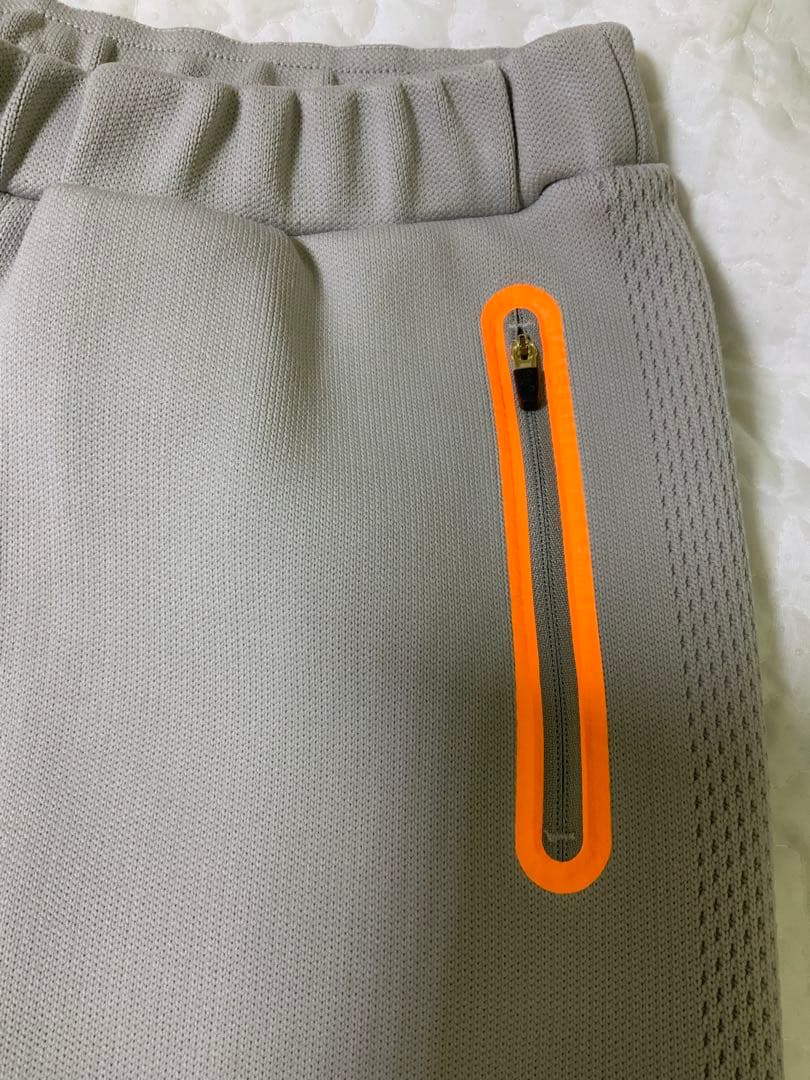 マークアンドロナレディースパンツ オレンジジッパー