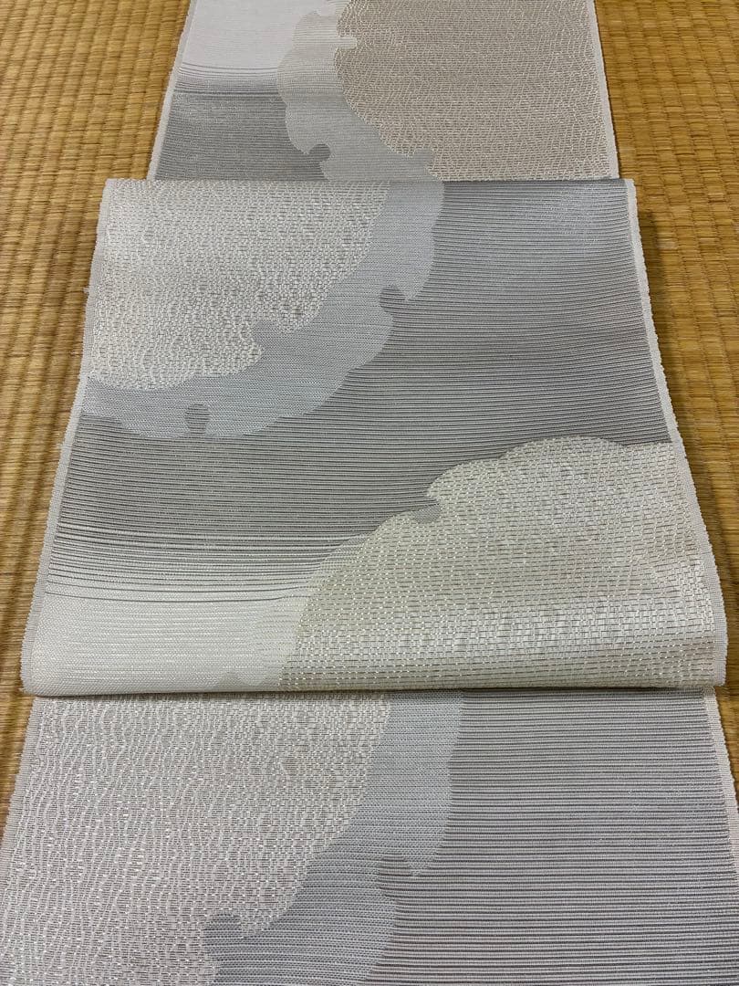 粋でモダンな装い！西陣全通名古屋帯 綿芯本仕立ガード加工済　雪輪文 簡易包装