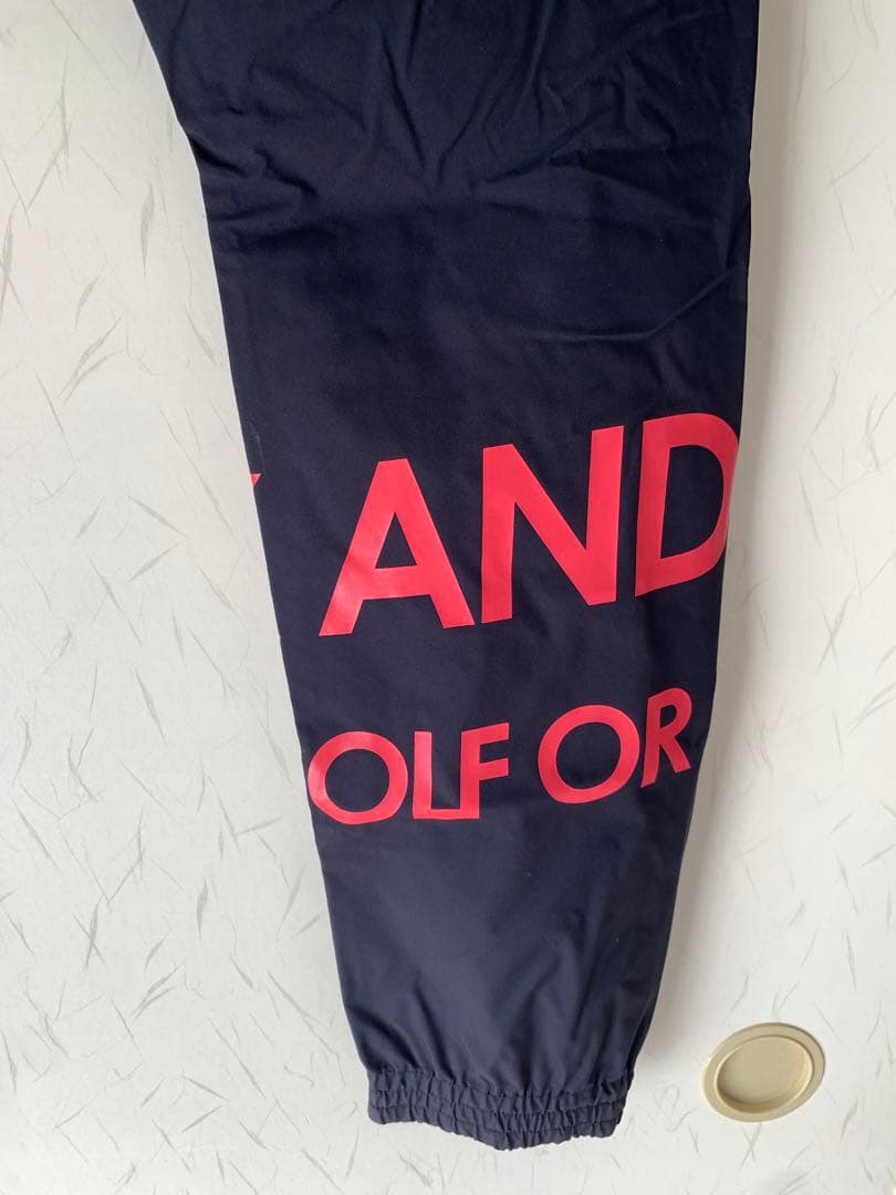 マークアンドロナ　komatsu レインウェア ブラック/レッド