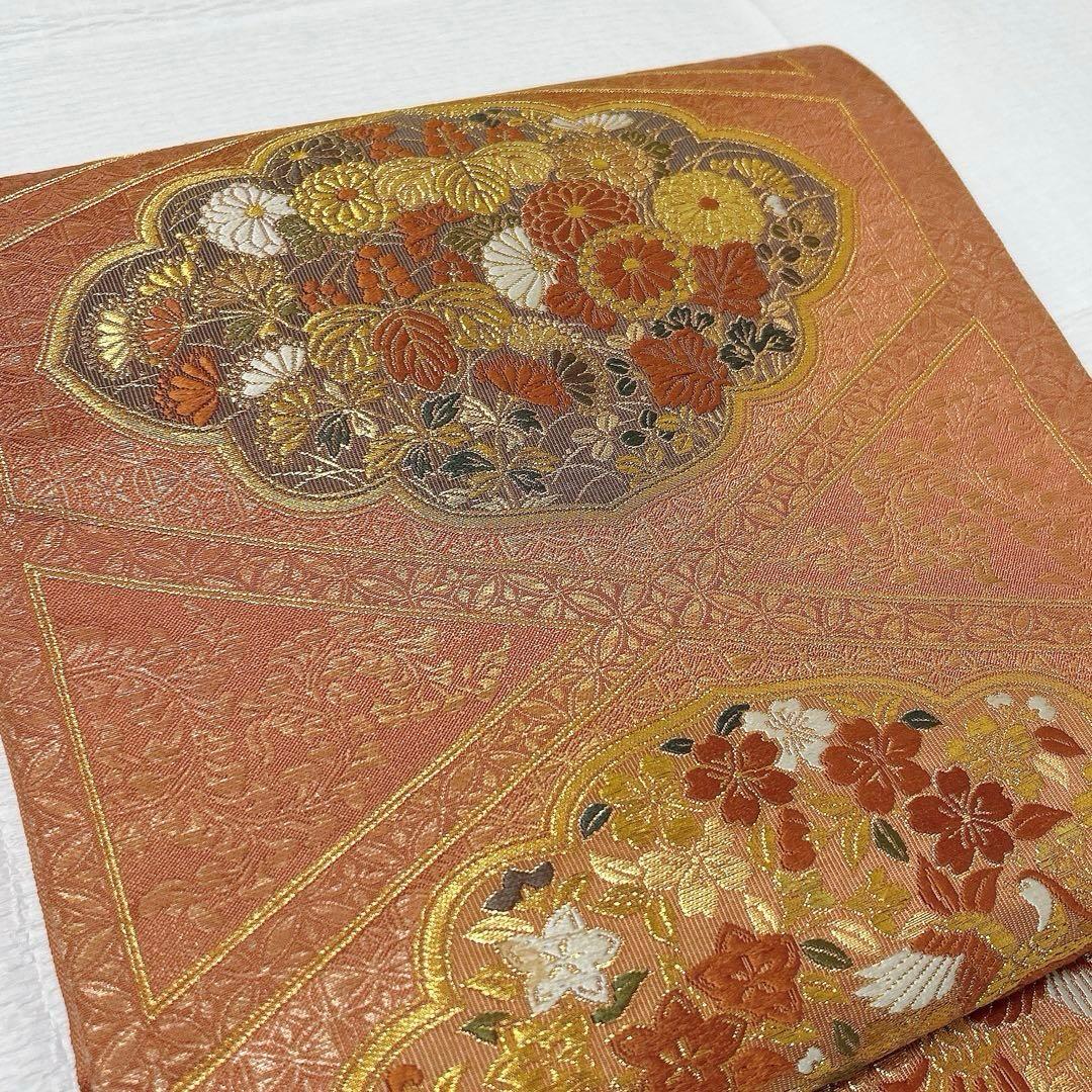 梅垣織物　袋帯　西陣織　七宝菱蒔絵文　正絹　金糸　オレンジゴールド系　逸品
