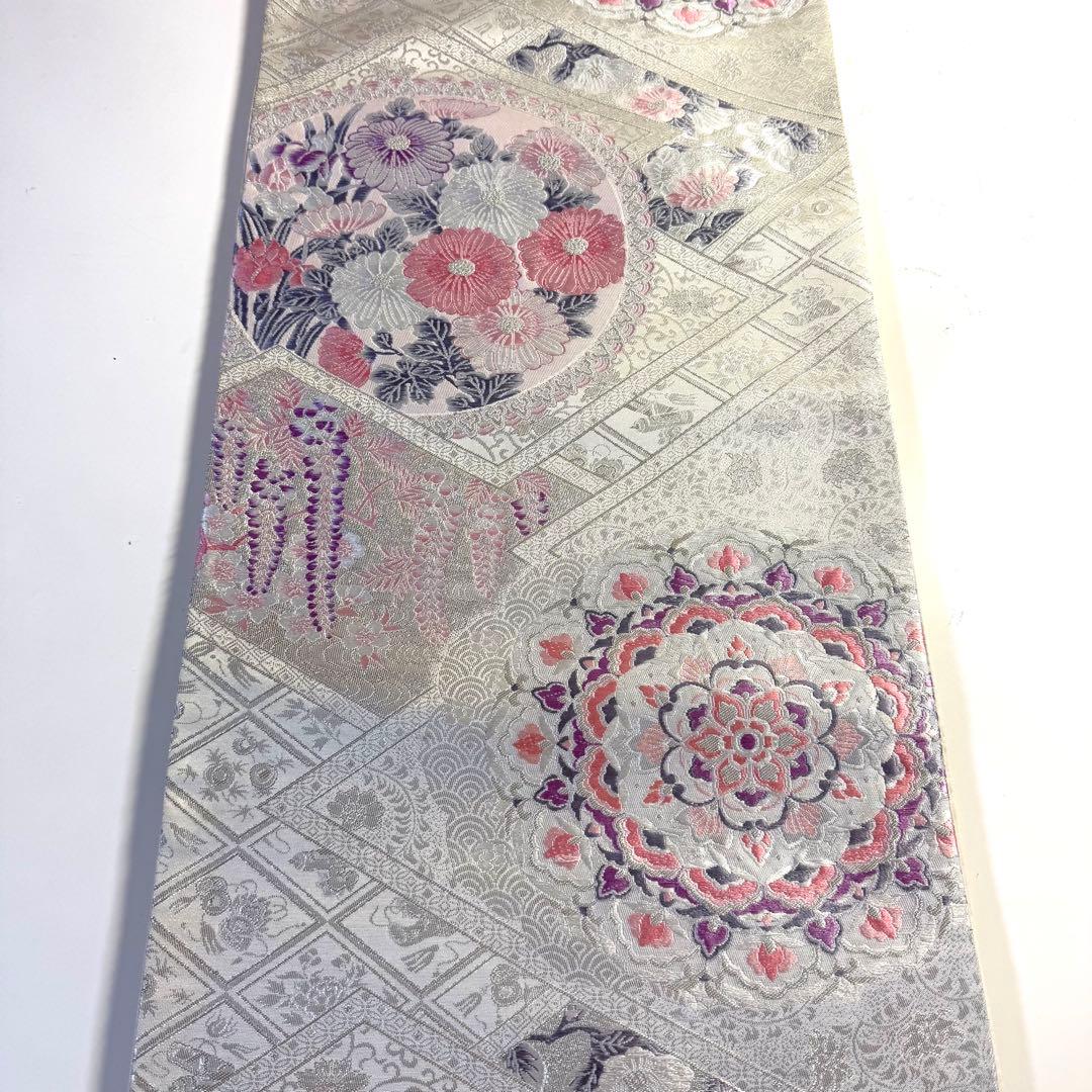 5k2780 袋帯　絹　唐織　プラチナ箔　正倉院文様　華文　銀色　白　ピンク　紫