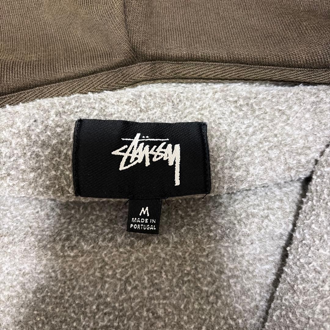 STUSSY オリーブ フーディ Mサイズ　ジップパーカー