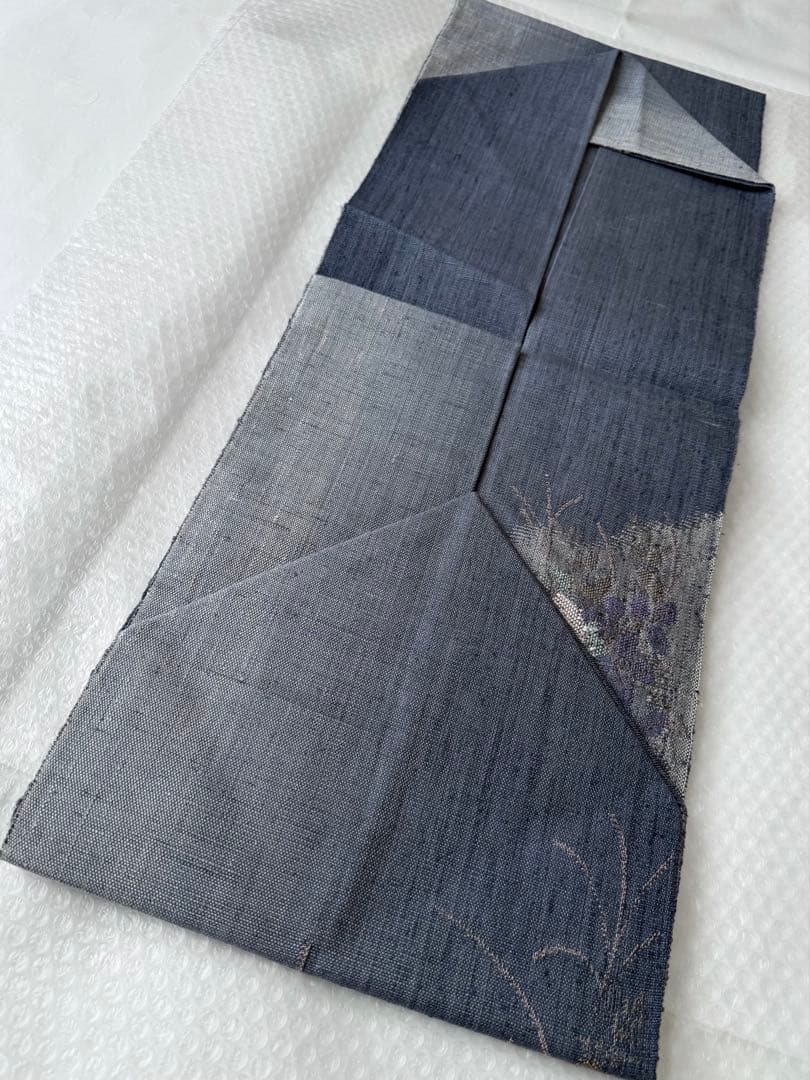 N34 美品 手織り真綿紬 万寿菊模様織出し 正絹 名古屋帯 ブルーグレー 暈し