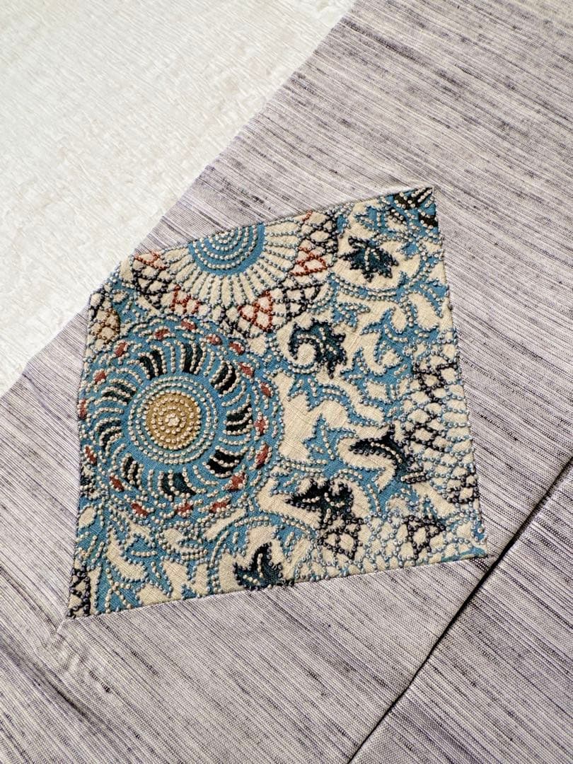 【未使用　お仕立て上り】　正絹　名古屋帯　紬地　型染めに相良刺繍　華唐草