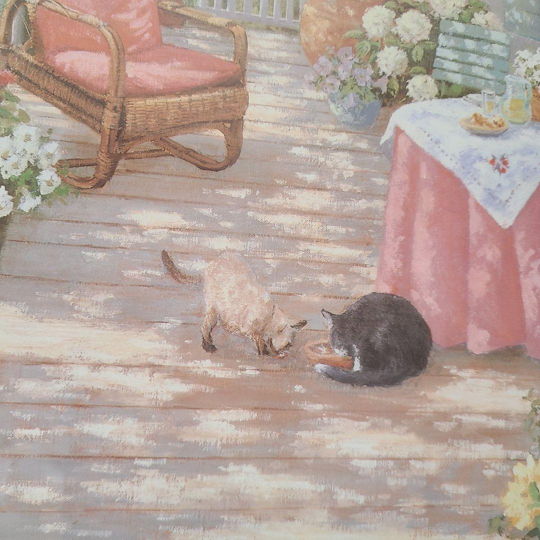 猫と花の絵画