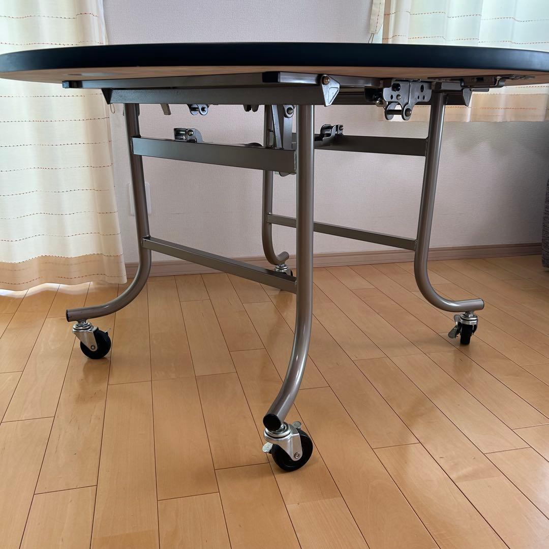 フライト式円型テーブル　折りたたみテーブル　直径120cm 丸テーブルキャスター