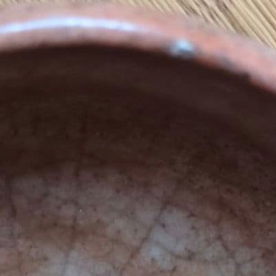 オレンジ色の陶器の茶碗　初代中村道年作赤楽茶碗