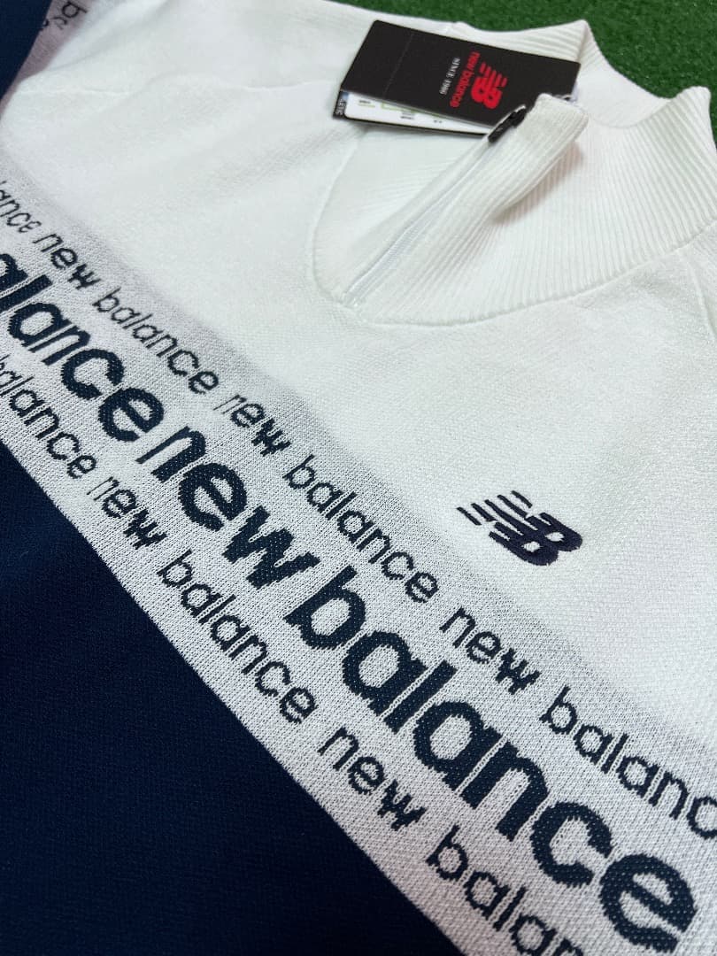 NewBalance ロゴライン軽量ハーフジップ スタンド ニット プルオーバー